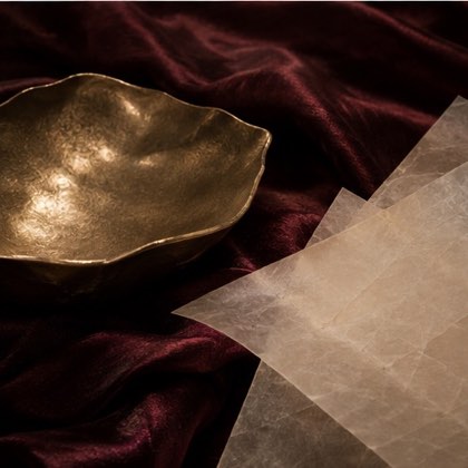 Burgundy fabric, translucent paper and aged brass